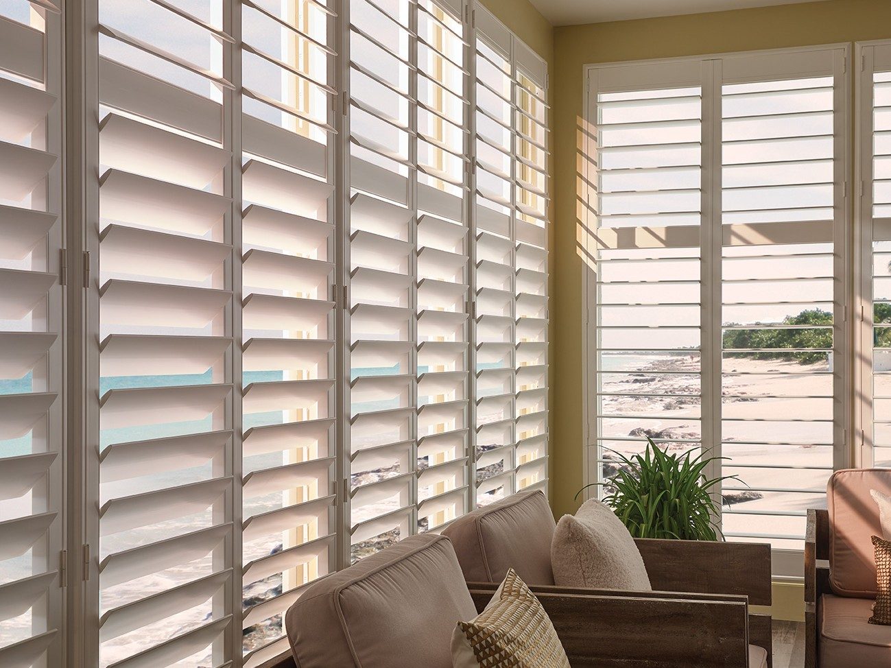polyresin white interior shutters over tall windows