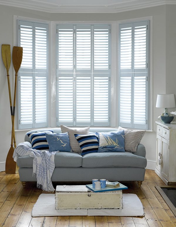 hinged shutters in a bay window