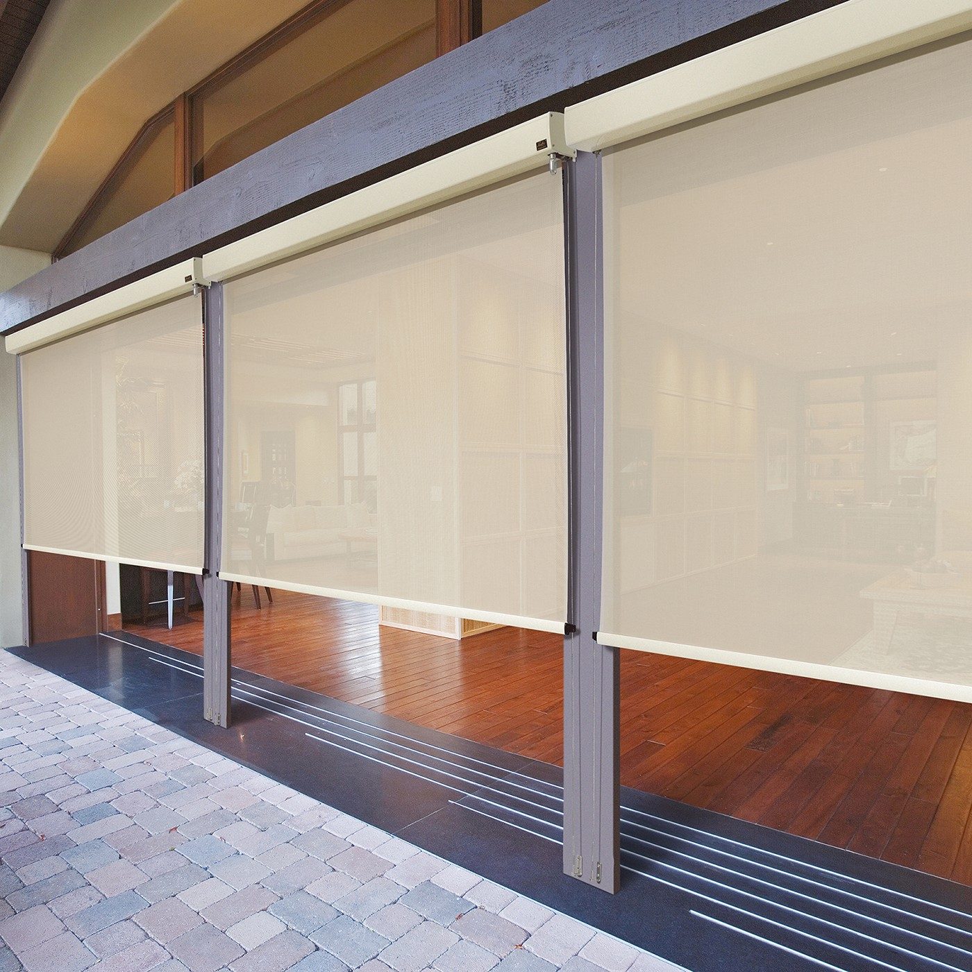 external alpha drop screens on a sliding window wall between brick patio and living room