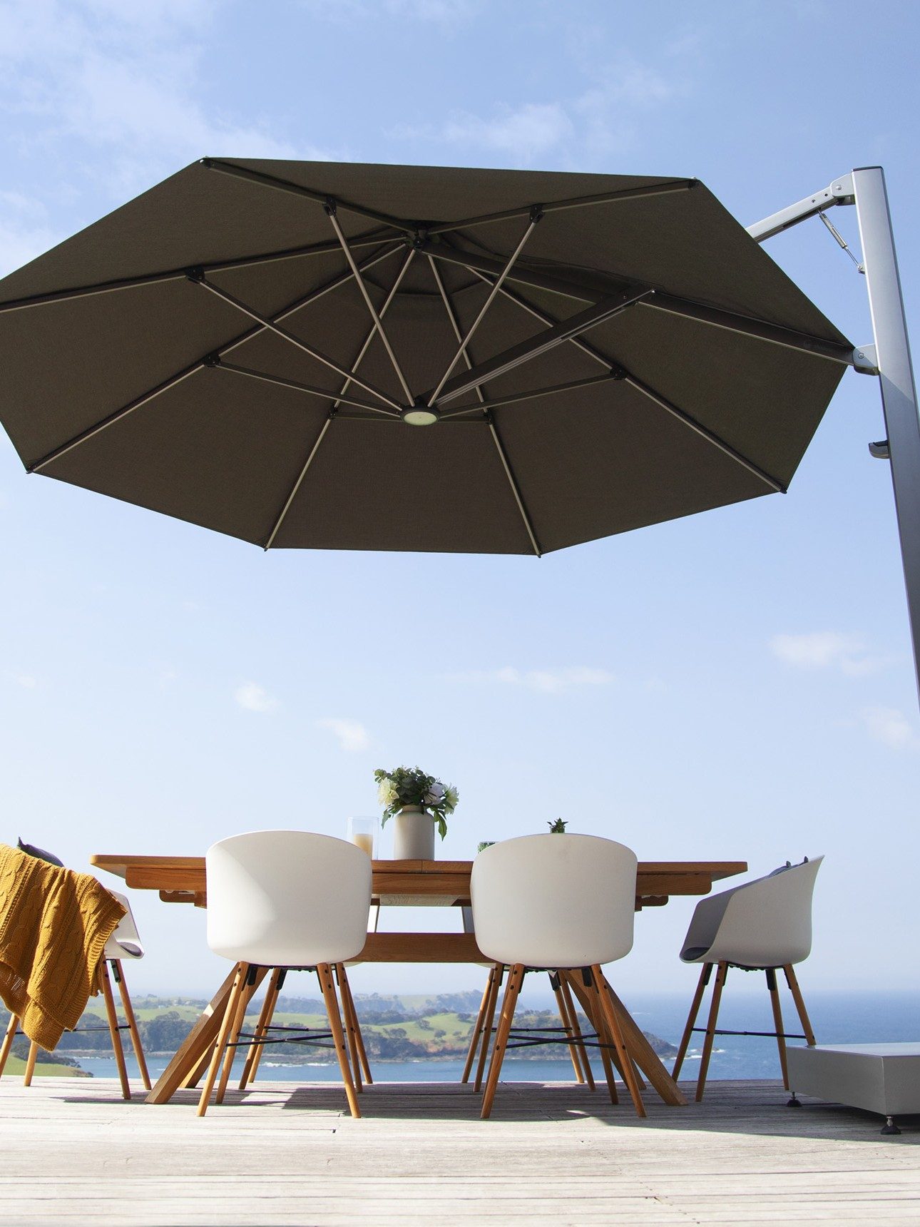 charcoal octagonal cantilever umbrella on stand