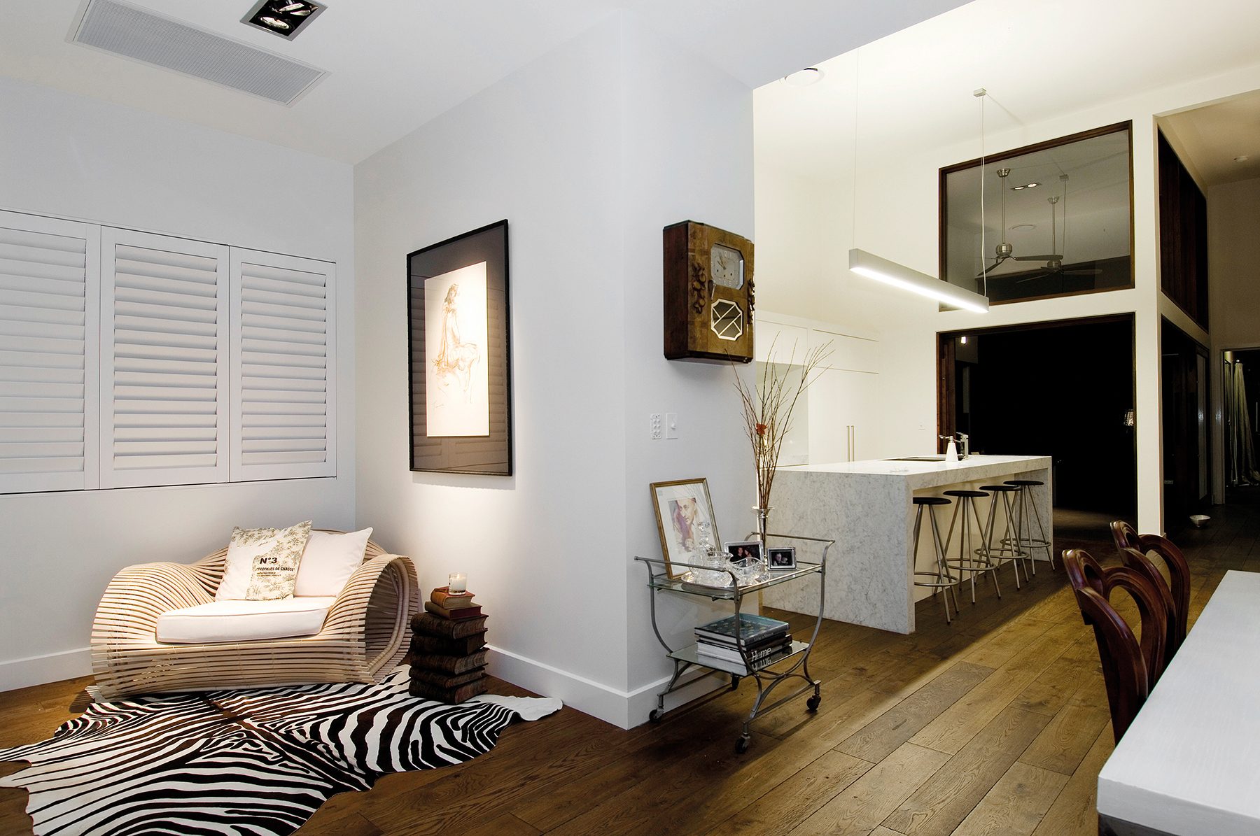 three white shutters in a reading nook